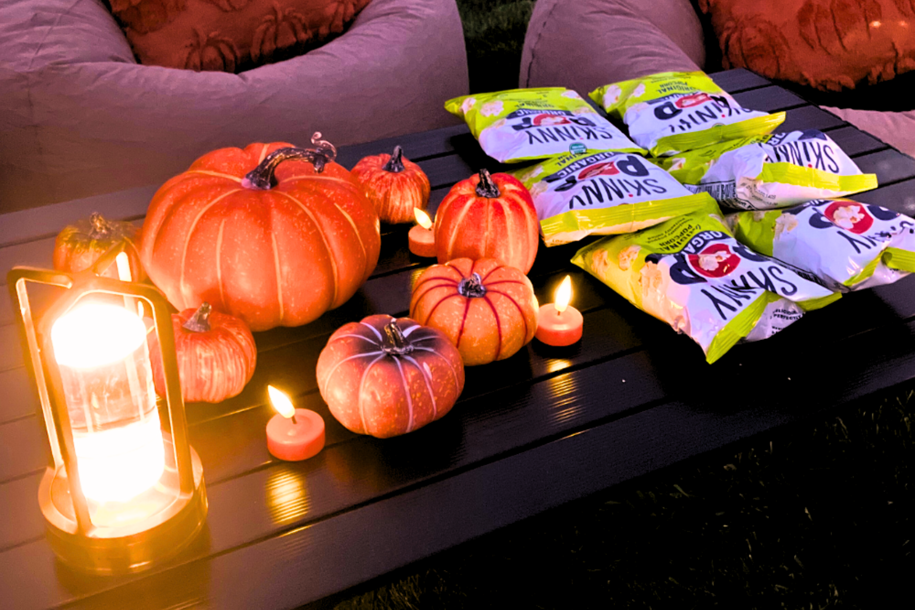 Movie night concession stand with popcorn, candy, and snacks at outdoor cinema